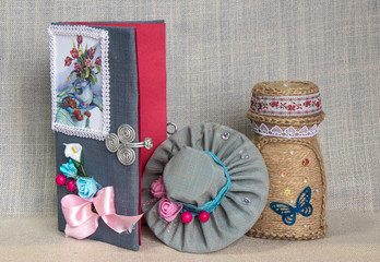 handmade products, paper cards, decorative work, flowers in pots on a wooden table