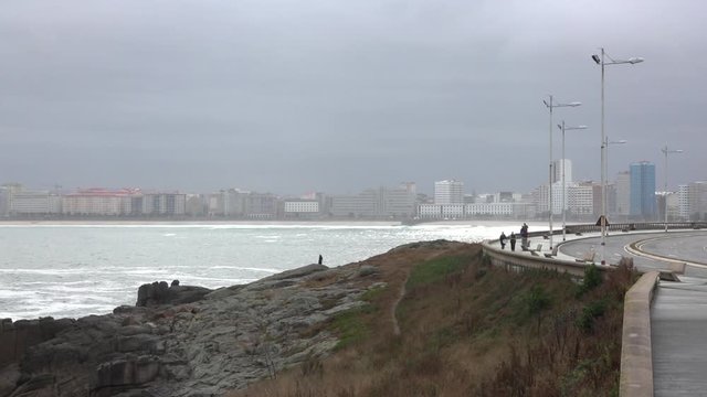 Riazor beach in the city of A Coru&ntilde;a with early morning mist and rising sun