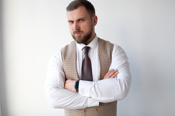 Male model in white shirt and plaid jacket, athletic build isolated on white background. The concept of classic clothes or office style.