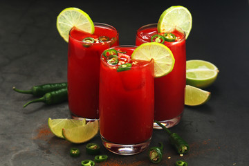 Jalapeno tomato margarita cocktail with lime	