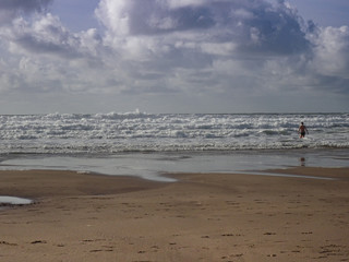 Fototapeta premium Male swimmer in ocean surf