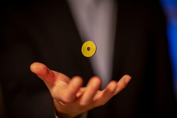 Businessman floats a coin