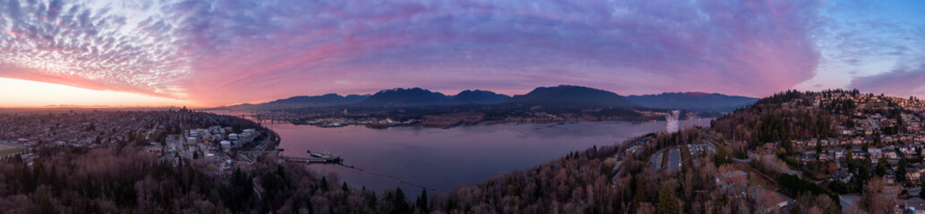 Aerial Panoramic View of a modern city during a colorful and cloudy sunset. Taken in Burnaby, Greater Vancouver, British Columbia, Canada.