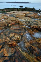 colorful rock near the ocean