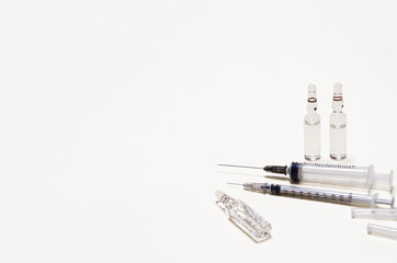 syringe and ampoules of intravenous, intramuscular injections on white background. healthcare...