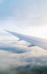 Wing of an airplane seen from the window during the flight