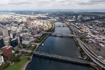 Aerial view of the Williamette River, bridges, buildings and streets in downtown Portland, Oregon, USA.