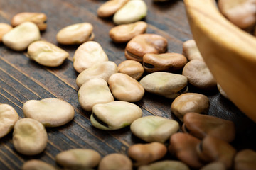 dry broad beans sprinkled on the table