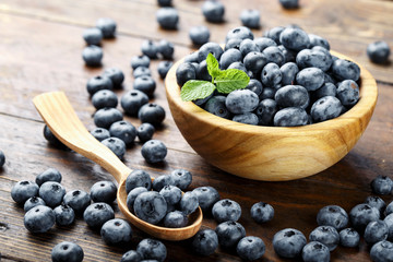 ripe blueberries on a wooden background