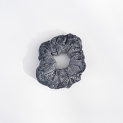 Grey scrunchie on white background