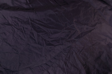 Dark satin material texture. Creative background.