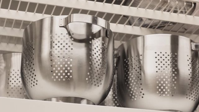 chrome colanders utensils for the kitchen and accessories . storage in the kitchen shelf