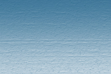 Textured abstract gradient from blue to light blue can be used as a background