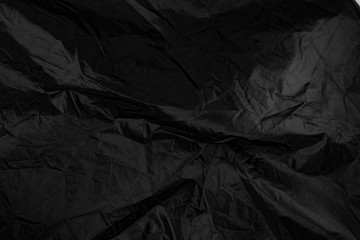 Dark satin material texture. Creative background.