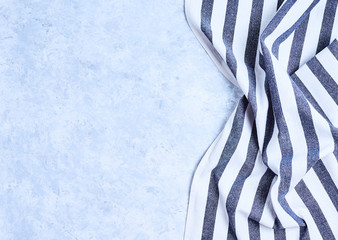 striped blue and white kitchen towel. Isolated on white background