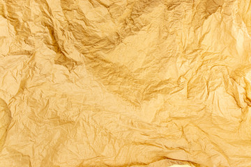 Fototapeta na wymiar Yellow, orange, warm background. Creased paper texture.