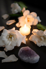 Obraz na płótnie Canvas Gardenia flowers, Amethyst, candle