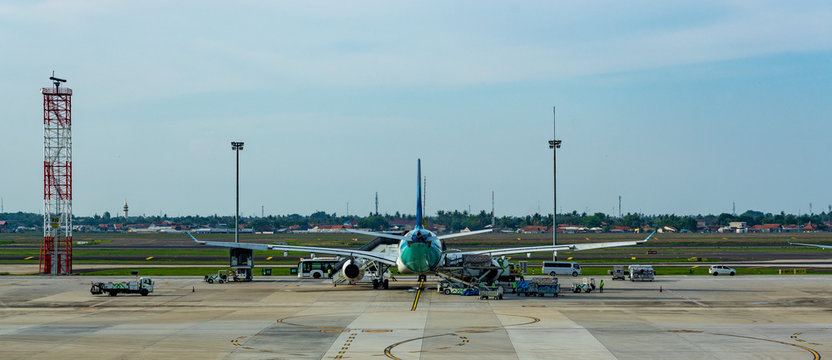 backside image of Airliner parking at  the international airport