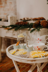 Close up of lemon slices against tea cups.