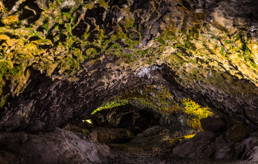 Illuminated lava tunnels in Sao Vicente Caves and Volcano Center. Result of the ancient volcanic eruption and magma flow now presented to tourists.