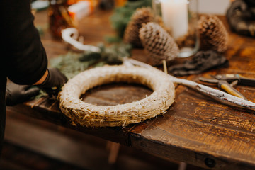 Christmas wreath workshop. Shears on wooden table