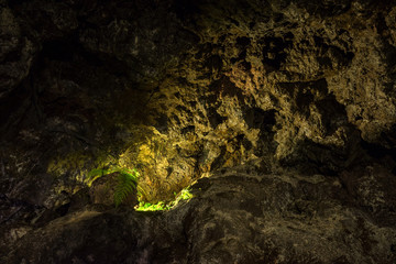 Illuminated lava tunnels in Sao Vicente Caves and Volcano Center. Result of the ancient volcanic eruption and magma flow now presented to tourists.
