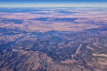 Colorado Rocky Mountains Aerial view from airplane of abstract Landscapes, peaks, canyons and rural cities in southwest Colorado and Utah. United States of America. USA.