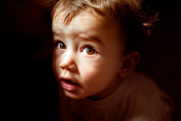 Portrait of a baby with intense expression.