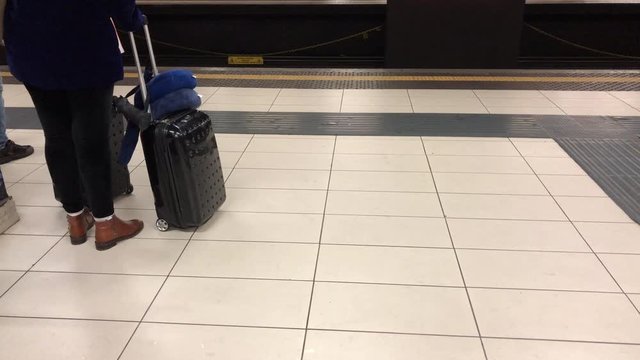 Milan metro, people waiting the metro tube subway