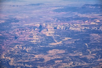 Fototapeta na wymiar Colorado Rocky Mountains Aerial view from airplane of abstract Landscapes, peaks, canyons and rural cities in southwest Colorado and Utah. United States of America. USA.