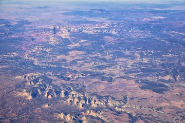 Fototapeta na wymiar Colorado Rocky Mountains Aerial view from airplane of abstract Landscapes, peaks, canyons and rural cities in southwest Colorado and Utah. United States of America. USA.