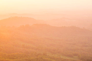 Obraz premium Beautiful Landscape of mountain layer in morning sun ray and winter fog at Doi Hua Mae Kham, Mae Salong Nai, Chiangrai, Thailand