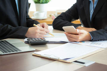 Brainstorming accountant financial auction statements proposal in corporation with the administration team