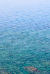 Background with a stone in the water of the Tyrrhenian Sea