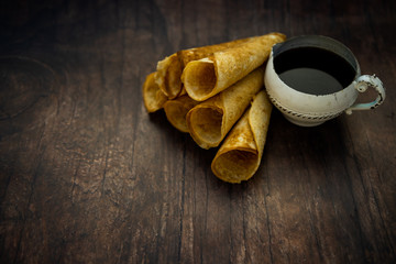 Norwegian Krumkake crispy wafer-like cookies with coffee