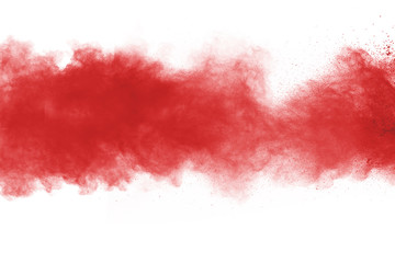 Red powder explosion on white background. Colored cloud. Colorful dust explode. Paint Holi.