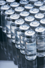 Glass medical ampoule vial for injection. Medicine is dry white drug penicillin powder or liquid...