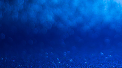 Naklejka premium abstract background with blue bokeh, lights and shadow.