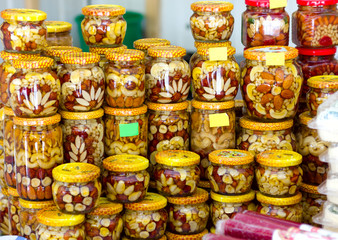 nuts filled with honey in glass jars souvenir in the oriental bazaar