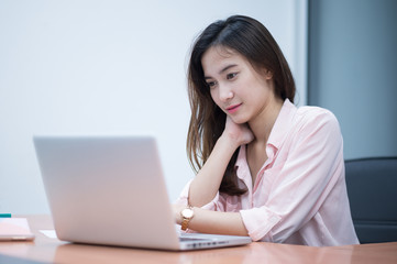 Asian woman working with laptop