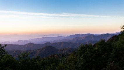 Fototapeta na wymiar Beautiful sunset over the mountain range at Ken Fin viewpoint ,Chiang Mai, Thailand