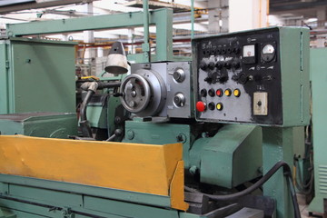 Old Soviet metal-removal turning lathe machine tool close up on Machine tool factory workshop