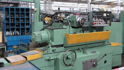 Old metal-removal turning lathe machine tool on Machine tool factory workshop