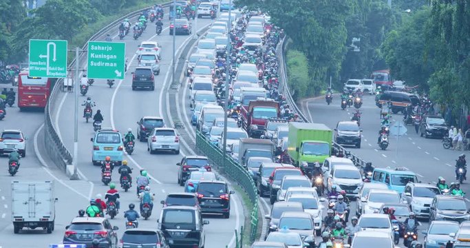 Rush hour traffic with vehicles queuing on the road