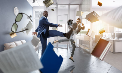 Soccer man in action with ball. Mixed media