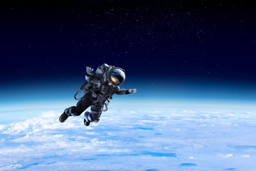 Fototapeta na wymiar Astronaut on space mission . Mixed media