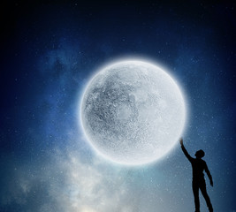 Fototapeta na wymiar Reaching the moon. Mixed media
