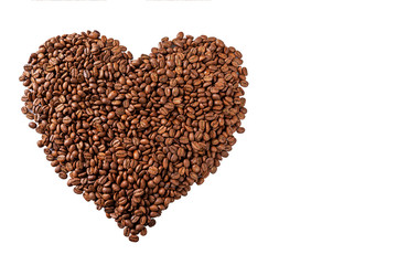 Heart shaped coffee beans. Isolated over white background. Close-up. Space for text.