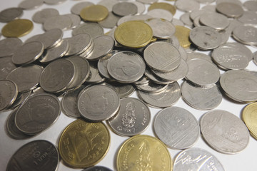 a pile of Coins money and white background, concept finance business investment. with selctive focus