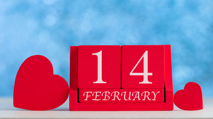 Date '' 14 February '' on wooden red cube calendar